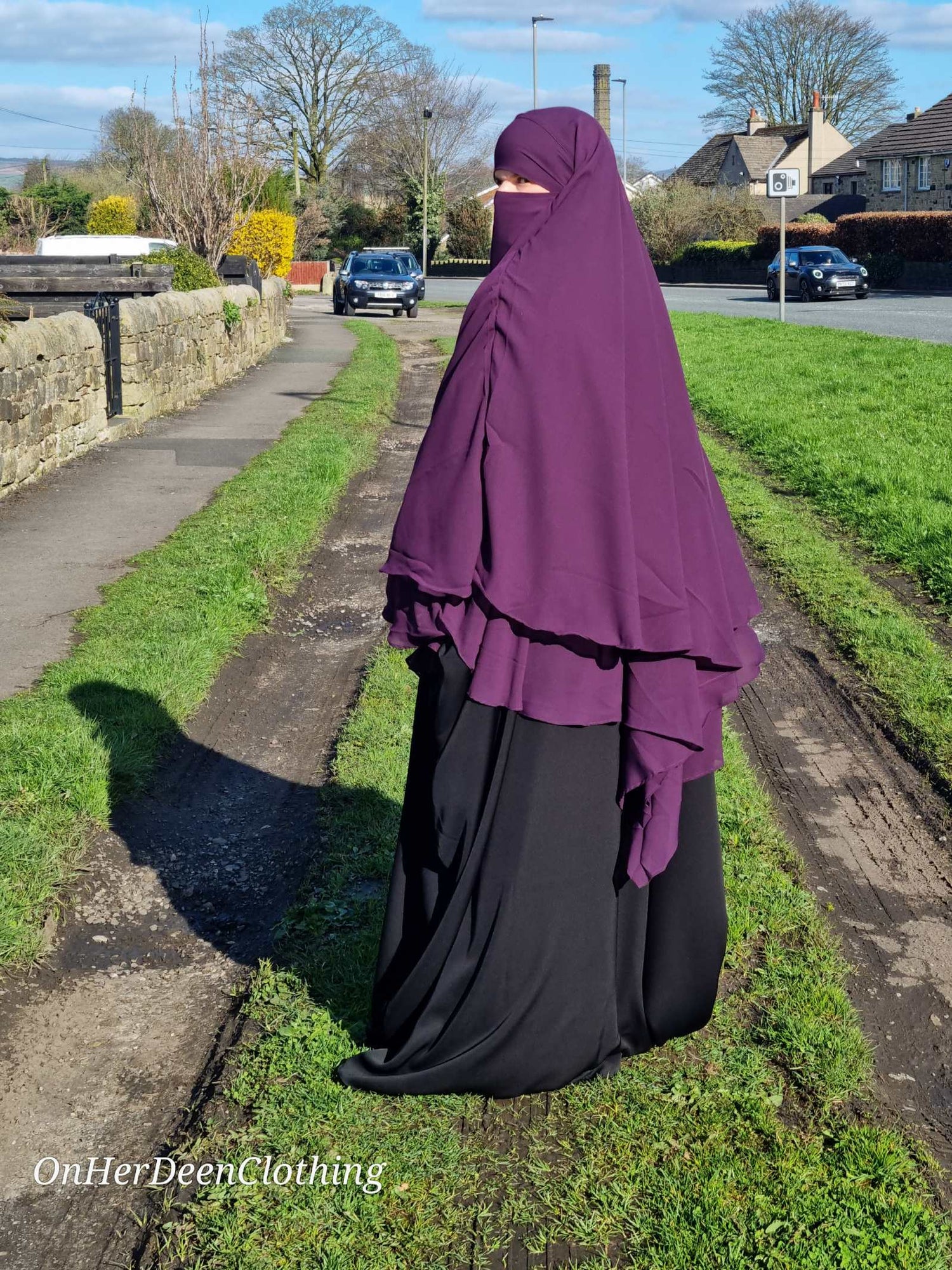 Women in a 2 layer chiffon purple -onherdeen clothing