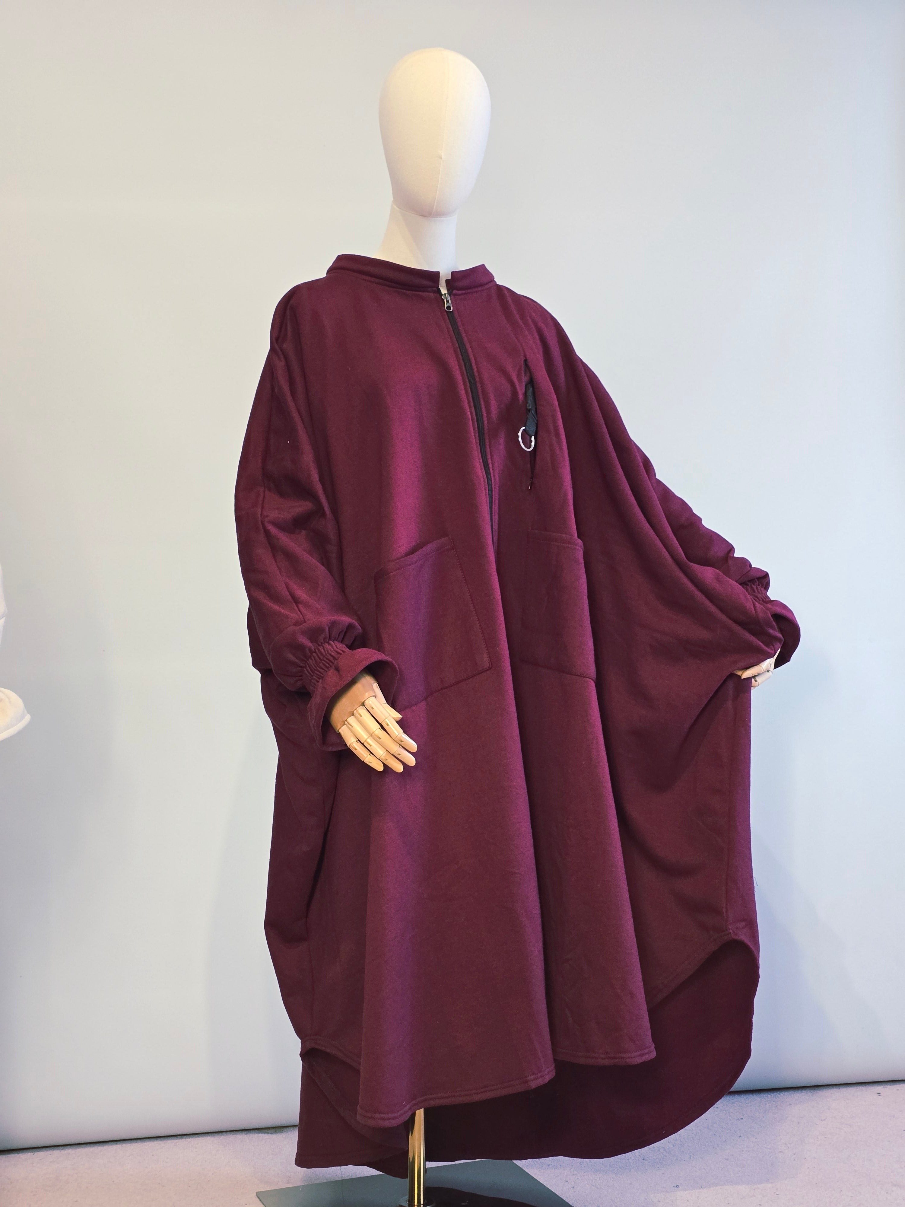 Maroon jacket on a mannequin against a white background