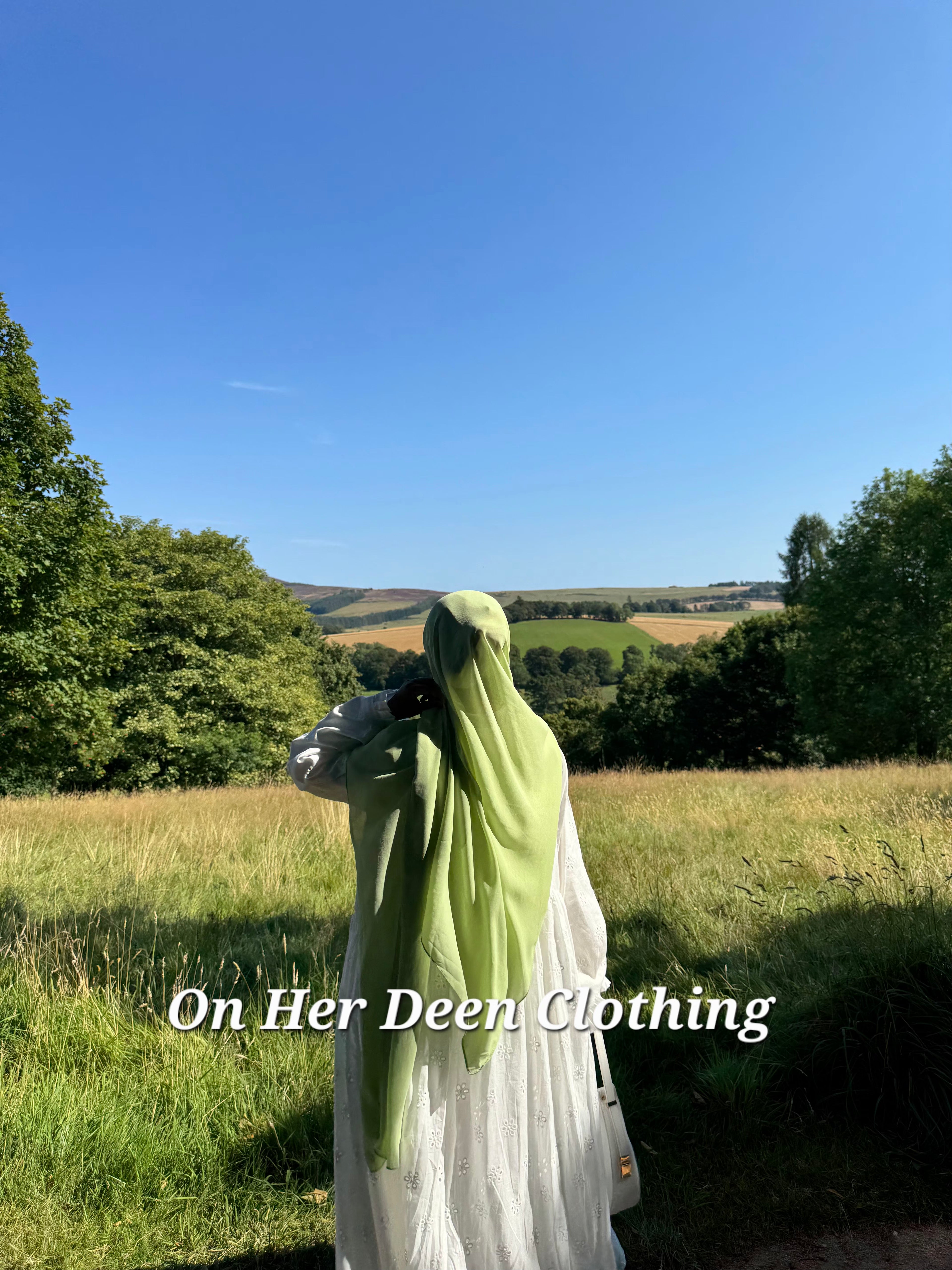 Modest fully lined eyelet cotton abaya with wide sleeves worn for everyday wear