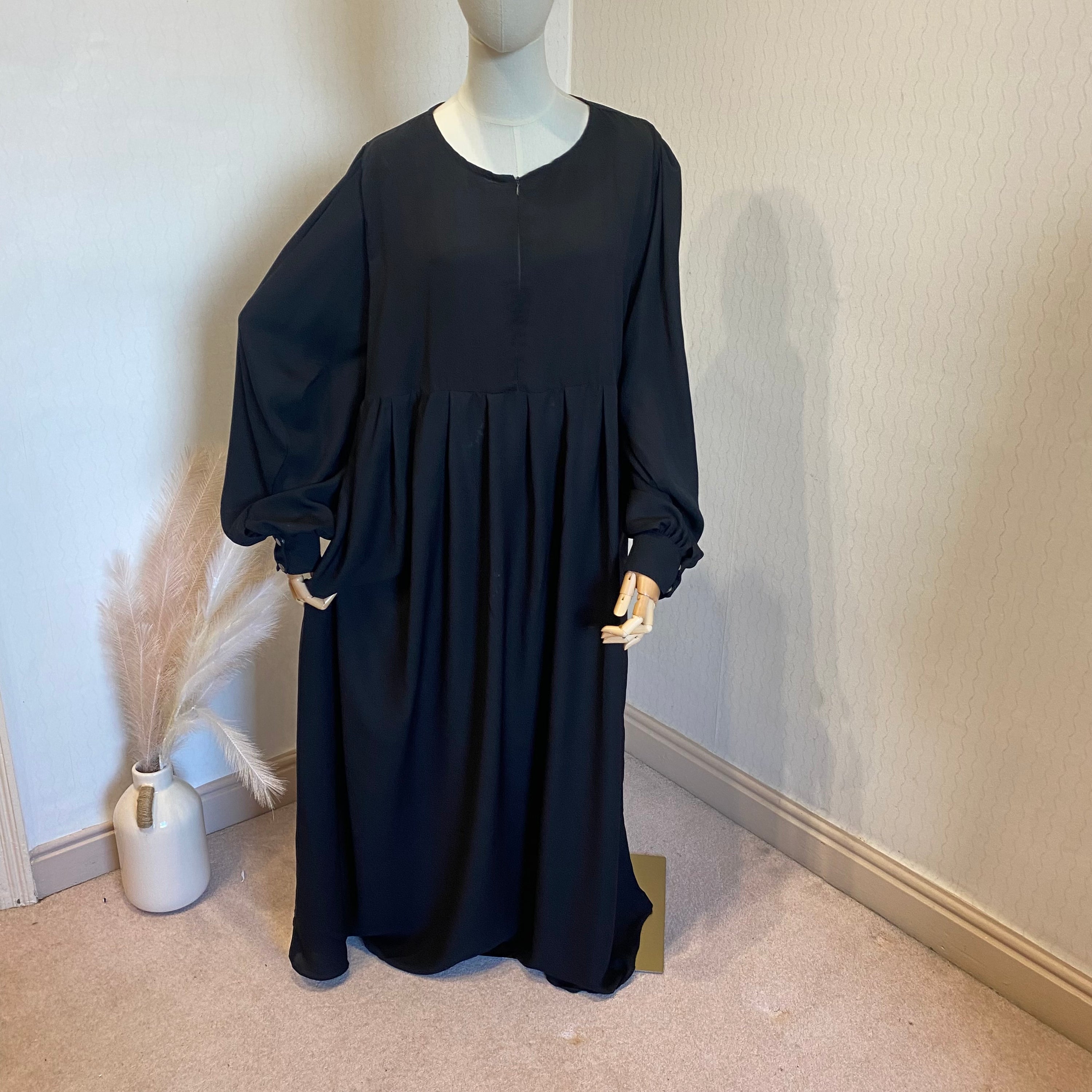 mannequin in a black abaya dress