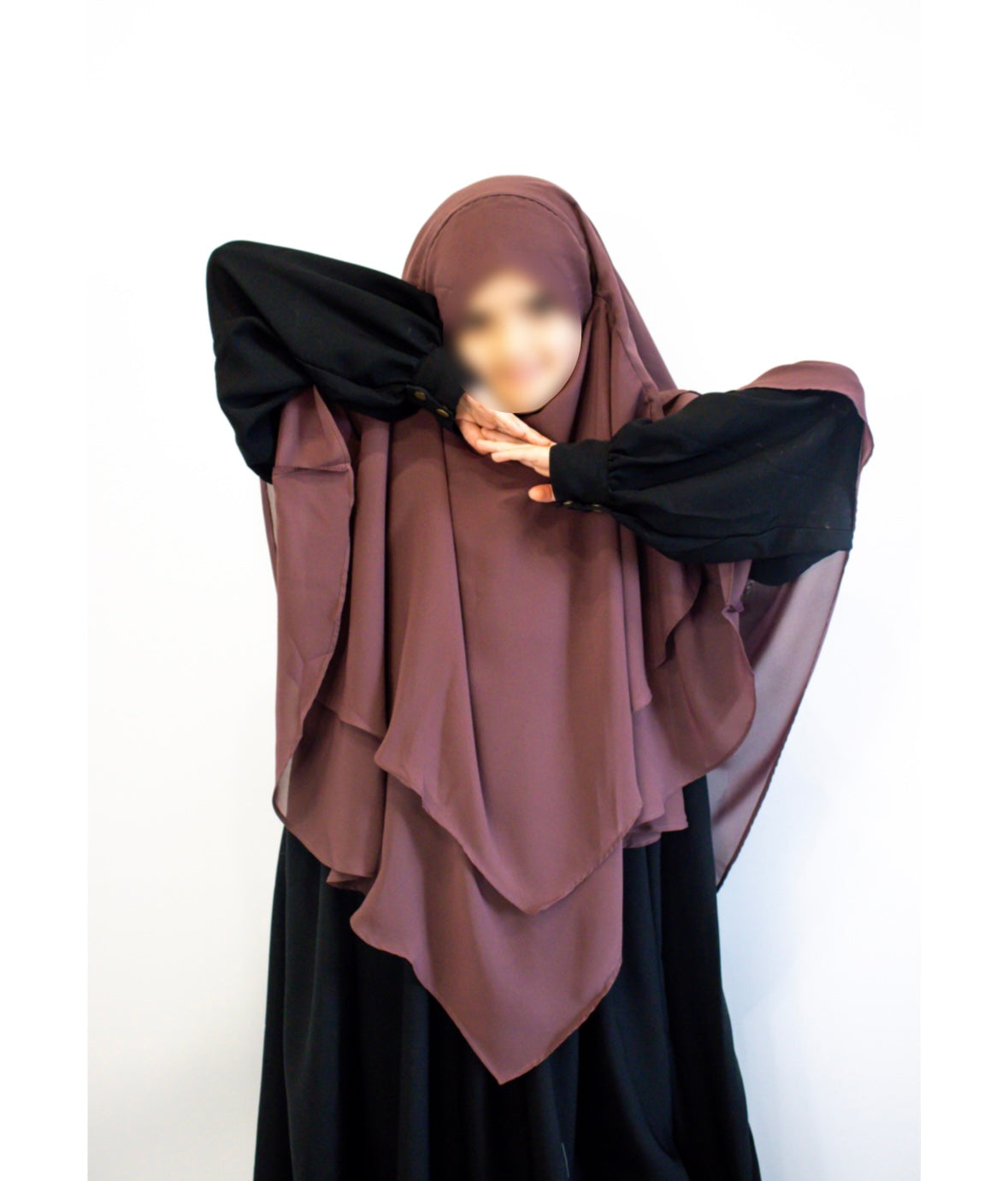 girls wearing dusky rose hijab and a black abaya on a white background