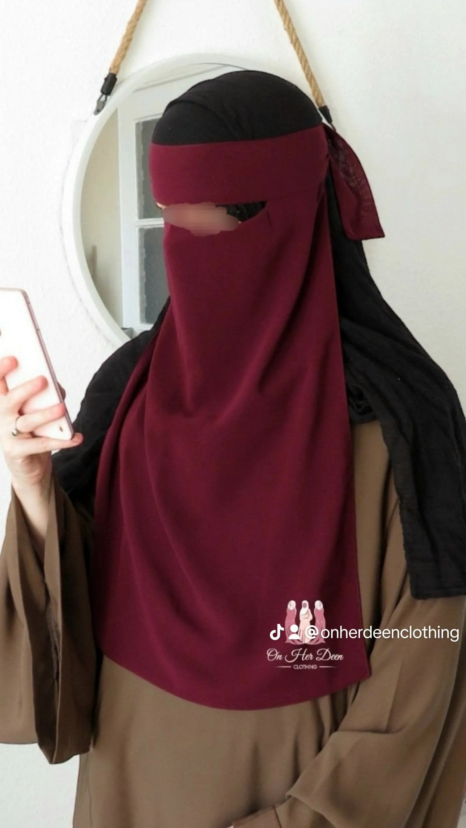 Women wear burgundy single layer niqab 