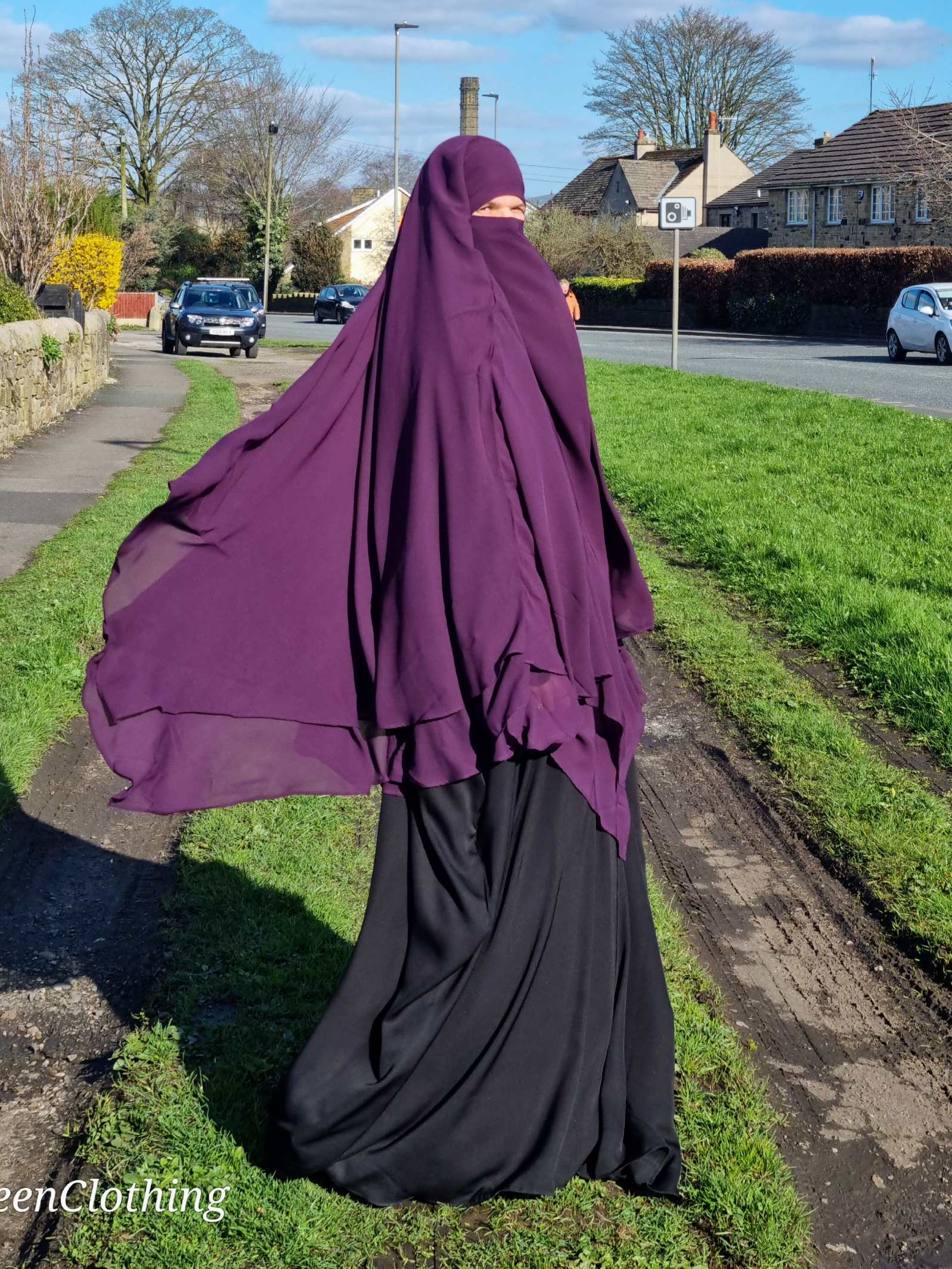 Woman in 2 layer chiffon Khimars purple from on her deen clothing 