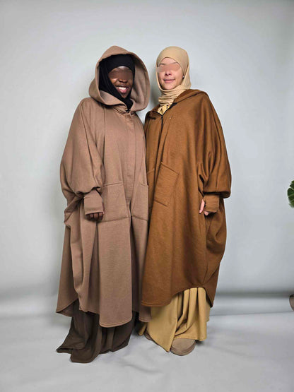 Two women in Al haya oversized poncho abaya fleece in mocha and taupe colours on a white background 