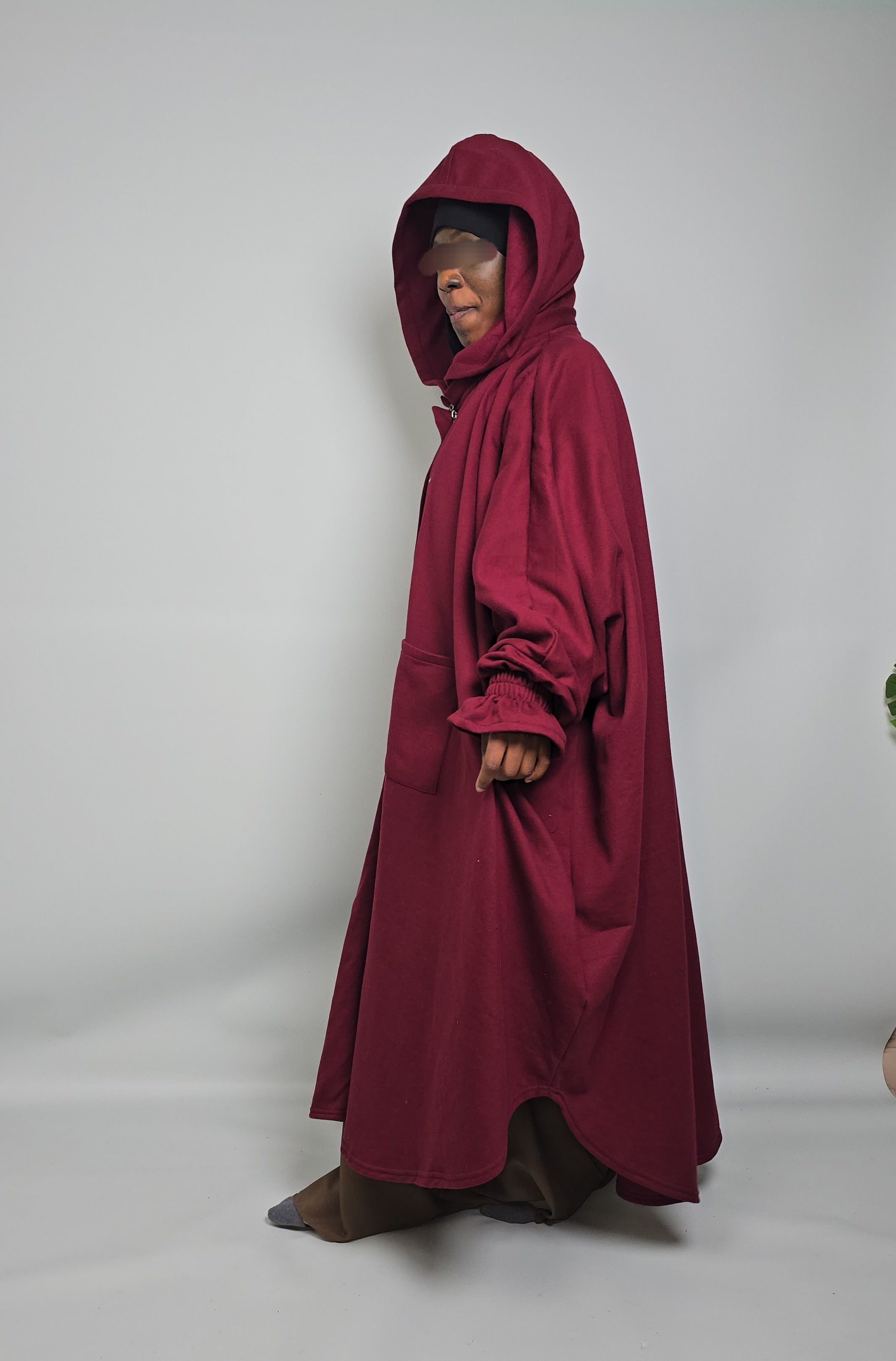Women walking in aura Oversized Poncho Abaya Fleece bell sleeves 