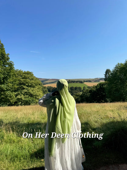 Modest fully lined eyelet cotton abaya with wide sleeves worn for everyday wear
