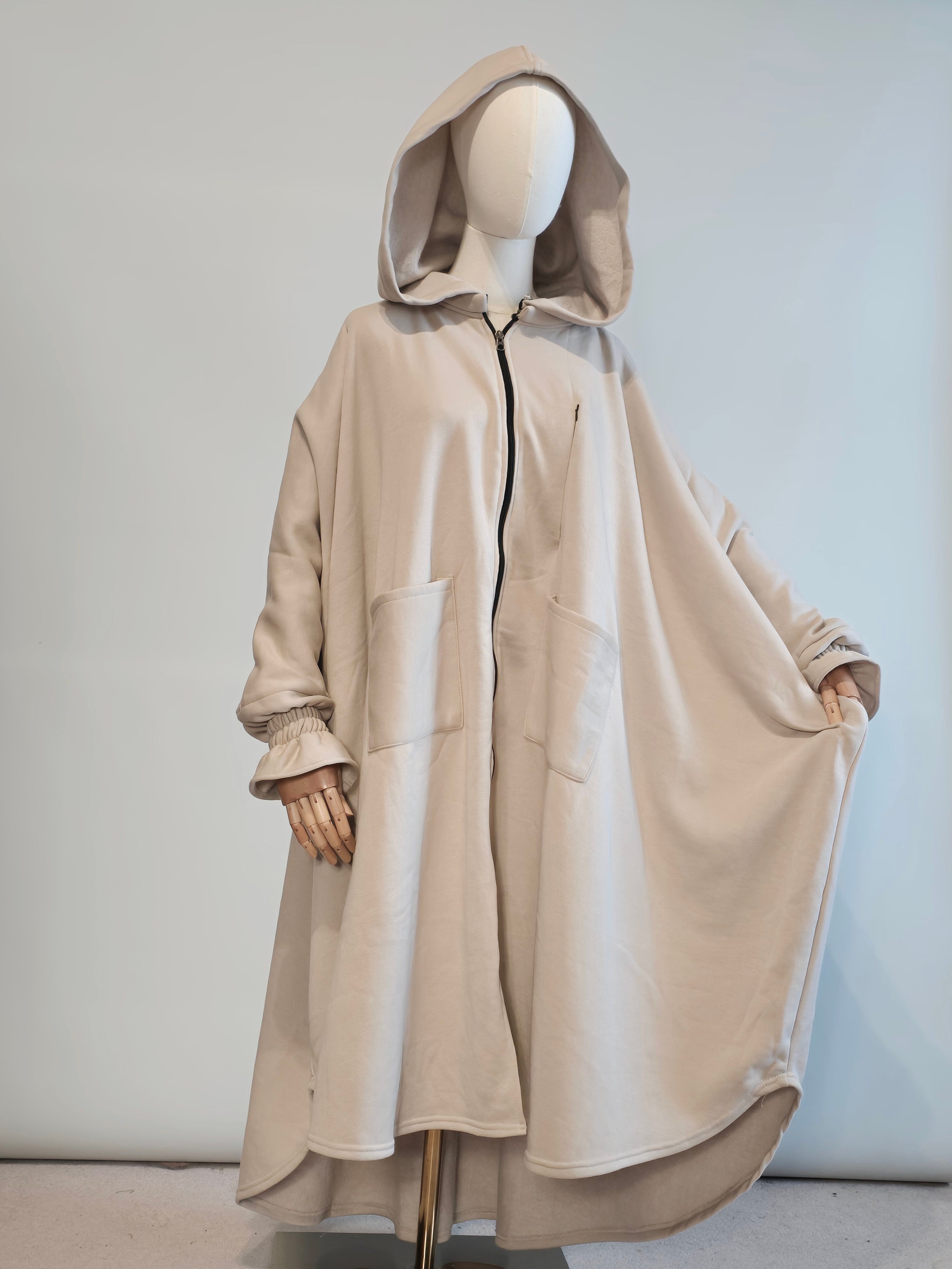 Oversized abaya hoodie musk white  on a mannequin against a light gray background