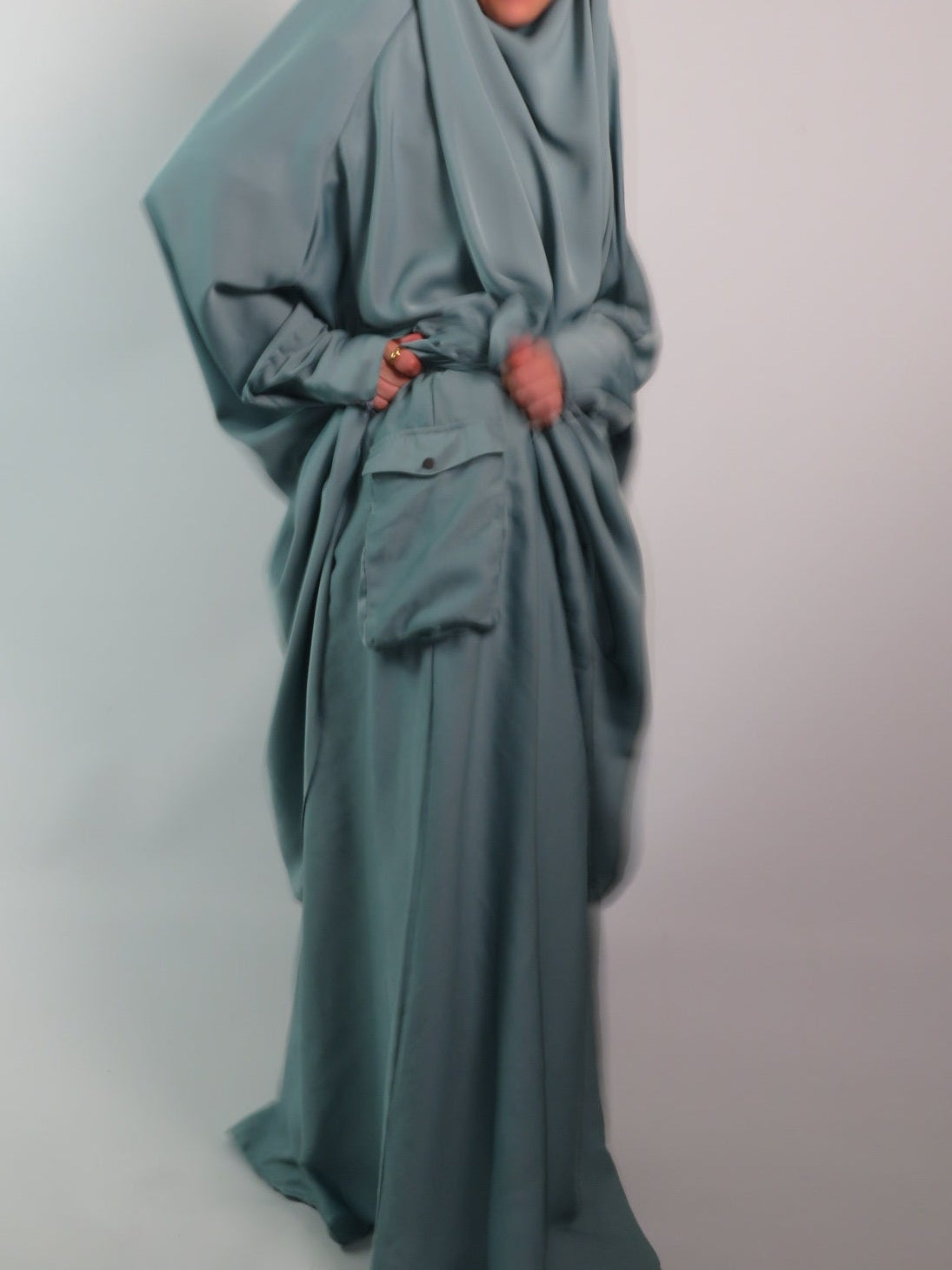 Women in 2 piece jilbab with cargo pocket and bisht sleeves 
