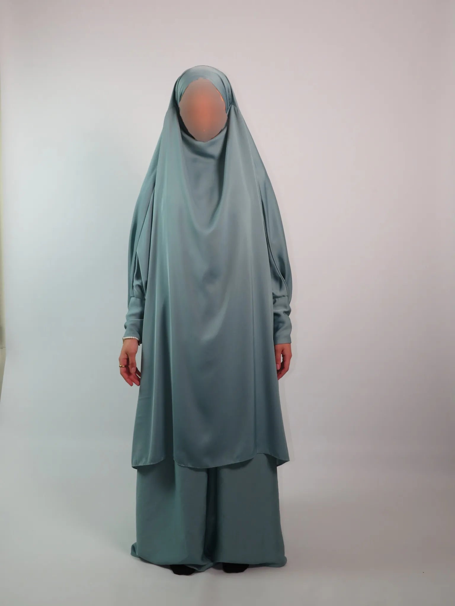 Women in 2 piece cargo pockets jilbab on a white background 