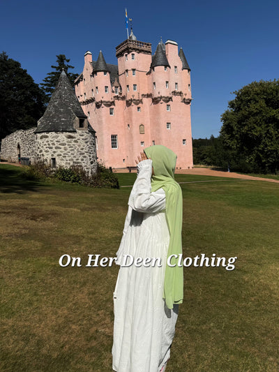 Modest fully lined eyelet cotton abaya with wide sleeves worn for everyday wear